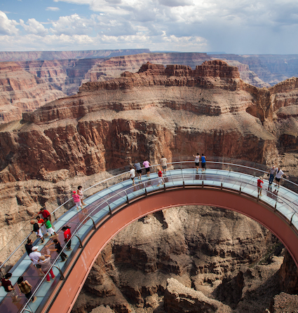 Grand Canyon Skywalk Express helicopter tour departing from Las Vegas. Incredible views of Hoover Dam & Bypass Bridge. Fly above and below the rim of Grand Canyon including front of the line VIP line pass access to Grand Canyon Skywalk
